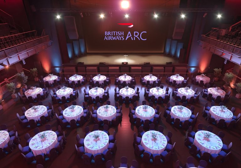 Venue Auditorium with banquet seating tables